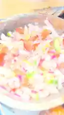 A close-up tour of a delicious-looking meal from Be Food 🍔🥗🥘🍜🍝. The plate features a whole baked fish topped with a fresh tomato, onion, and cucumber salsa, served alongside a mound of rice and golden fried plantain slices. The camera pans around the food, highlighting its appetizing textures and colors. by @be_food with FASHION DESIGNA by Theodora