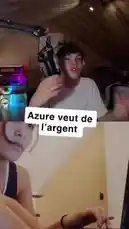 A split-screen view shows a male streamer from Team Azure in his gaming room, speaking animatedly into a microphone about Twitch's monetization options. He expresses frustration that he receives no money despite enabling ads. On the other side of the screen, a female viewer watches intently, her face partially obscured. by @justeazure with Original Sound by justeazure