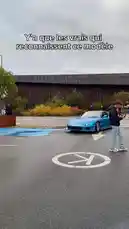 A vibrant blue Mazda RX-7 drifts through a parking lot, showcasing its modified body kit and gold wheels. The car, driven by AnasDC, navigates tight turns as onlookers watch. The scene captures the essence of European car culture. by @anasdc01 with Original Sound by Contains: Pilates - 41, Kyle Richh, Jenn Carter, TaTa