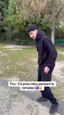 In this POV-style clip, Izerfly walks through a residential area, showcasing his casual black 'La Dolce Vita' hoodie and relaxed demeanor. The video captures his journey from a park-like setting to a parking lot, highlighting everyday moments during Ramadan. by @izerflyy with Original Sound by izerflyy