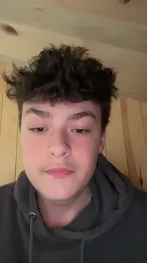 A young man in a dark hoodie, identified as part of Team Azure, lip-syncs and dances energetically to a popular French song. He performs a distinct hand gesture while moving his head and shoulders to the upbeat music. by @justeazure with Original Sound by Contains: Fruit De La Passion - Francky Vincent