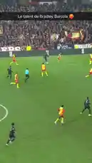 This video captures a dynamic moment from a French Ligue 1 football match. A player in a black jersey skillfully dribbles past an opponent wearing a yellow and red uniform. The fast-paced action unfolds on a well-lit pitch before a large crowd, showcasing the intensity and athleticism of professional soccer. by @ligue1 with Original Sound by ligue1