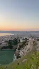 This stunning panoramic view captures the breathtaking sunset over the city of Marseille, France. The camera sweeps across the urban landscape, showcasing the Mediterranean Sea, the iconic Vieux Port, and the surrounding hillsides, all bathed in the warm, golden light of dusk. by @omofficial with Original Sound by Contains: Sensations - JUL
