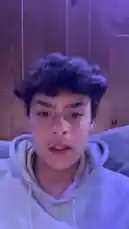 A young man, identified as part of Team Azure, lip-syncs to a popular French rap track. He appears to be in his room, reacting to the song's lyrics about falling for someone. This short-form reaction captures a moment of youth culture and music fandom. by @justeazure with tombé pour elle by rmy.bonm