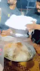 Watch as Mr. Sahir demonstrates the final step of preparing a delicious biryani dish. In this close-up cooking tutorial, he carefully lifts the lid off a large metal pot, releasing a cloud of aromatic steam over a beautifully layered rice and meat platter. The video captures the sizzling, fragrant process of serving homemade biryani, perfect for food enthusiasts and home cooks looking to master this classic recipe. by @mrsahir00 with Original Sound by mrsahir00
