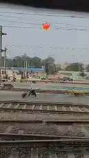 This first-person perspective video captures a journey through an Indian railway station, showcasing the bustling platform life, multiple train tracks, and the iconic Indian Railways locomotive. It's a slice-of-life look at the heart of India's transportation system. by @guptaji_47 with original sound