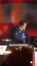 Witness the triumphant 'Walk of a Champion' as chess legend Magnus Carlsen celebrates his victory at the Esports World Cup 2026. The video captures him receiving a large, circular championship belt and a smaller triangular trophy on stage, set against a backdrop of celebratory pyrotechnics and a list of tournament results. by @chesscomindia with Original Sound by chesscomindia