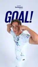 A male football player wearing a light blue and white patterned jersey with 'Betsson sport' branding celebrates a goal. He raises his arms in triumph, flexing his muscles while looking directly at the camera. The word 'GOAL!' is displayed prominently above him against a clean white background. The image conveys excitement and athletic achievement. by @interofficial with original sound