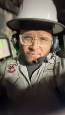 This first-person perspective video features Tomas Guerrero in full industrial safety gear, including a hard hat, headset, and protective jacket. He is situated in a dark, complex environment filled with pipes and machinery, suggesting a tour or work inside a facility like a power plant or factory. The intense, continuous mechanical rumbling sound indicates he is very close to large operating equipment. by @tomasg3901 with Original Sound by tomasg3901