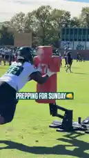This behind-the-scenes look at the Philadelphia Eagles' training camp shows players in full gear executing drills at the Jefferson Health Training Complex. From tackling sleds to catching passes and running routes, the footage captures the team's focused preparation for their upcoming game. Coaches are actively involved, providing instruction and feedback during these crucial practice sessions. by @eagles with Original Sound by eagles
