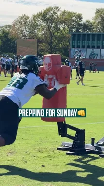 This behind-the-scenes look at the Philadelphia Eagles' training camp shows players in full gear executing drills at the Jefferson Health Training Complex. From tackling sleds to catching passes and running routes, the footage captures the team's focused preparation for their upcoming game. Coaches are actively involved, providing instruction and feedback during these crucial practice sessions. by @eagles with Original Sound by eagles