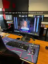 This behind-the-scenes look reveals a professional chess streamer's gaming setup during a live 'LEGACY LAUNCH' event on Chess.com. The scene features a high-end computer, ergonomic chair, branded mousepad, and multiple monitors, all set within a modern streaming studio environment. The streamer, visible on screen, discusses the new feature while the camera focuses on the hardware and workspace, offering viewers insight into the world of competitive online chess. by @chesscom with original sound