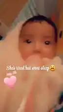 A heartwarming close-up of a baby wrapped in a soft white blanket, looking directly into the camera. The scene is enhanced with a pink heart graphic and 'Aug.28' text overlay, creating a sweet, personal moment perfect for social sharing. by @alonamia22 with original sound