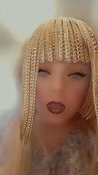 Preview for a Spotlight video that uses the Gold Chain Wig Lens