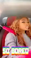 In this candid clip, Seriously FD sits in her car, looking bored and unimpressed. She wears a sparkly silver top and large hoop earrings, with a pink seatbelt cover adding a pop of color. The text overlay 'SO BORED' perfectly captures the mood. This authentic, short-form content is ideal for fans of relatable lifestyle moments. by @seriouslyfd with Original Sound by seriouslyfd