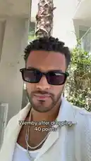 In this energetic clip, Jeremiah Brown shares his reaction after scoring 40 points in a game. He looks confident and stylish in a white jacket and sunglasses, delivering a triumphant 'It's time to play the game!' before laughing in celebration. by @findjeremiah with Original Sound by findjeremiah