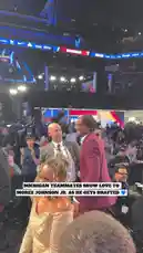 In a vibrant and energetic atmosphere at the NBA Draft 2023, newly selected players are seen celebrating their achievements on stage. Dressed in sharp suits, they embrace teammates and share joyful moments amidst the excitement of the event. The crowd cheers loudly, creating a festive environment filled with anticipation and triumph. by @nba with Original Sound by nba