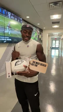 In this heartwarming fan engagement video, Philadelphia Eagles players personally select fans to receive autographed memorabilia. From a young fan in a Kelly Green Cooper DeJean jersey to a towering supporter in Section 123, the players deliver gifts like footballs, jerseys, and helmets to fans in the upper decks and tailgating areas. The video captures the excitement and surprise on the fans' faces as they receive these special tokens from their favorite athletes. by @eagles with Original Sound by eagles