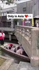 This captivating footage shows a traditional boat tour guide navigating a canal using a long pole. He skillfully maneuvers his small wooden boat under a stone bridge and along the waterway, demonstrating a unique method of transportation common in parts of Asia. by @eirakoze64 with Original Sound by borgatv