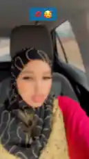 Watch Nurse Amal share a candid moment from her day as she drives in her car. She's wearing a stylish black hijab with gold patterns, layered over a red top and yellow vest. This authentic glimpse into her routine showcases her vibrant personality and fashion sense. by @ilwaad67 with Original Sound by ilwaad67