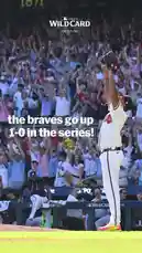 A pitcher from the Atlanta Braves celebrates after securing a victory in a baseball game. He raises his arms triumphantly on the mound as the crowd erupts in cheers. Text overlays announce 'the braves go up 1-0 in the series!' and 'we'll see you tomorrow back in ATL,' capturing the excitement of a pivotal win. by @mlb with Original Sound by mlb
