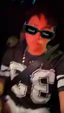 tufavlatiino 님이 만든 Original Sound 포함 @tufavlatiino 님이 만든 A person wearing a 'Good Vibes' sunglasses filter, a black and white jersey with the number 5, and white shorts enjoys a night out. They are seen adjusting their hair and smiling while sitting in a car with a seatbelt on. The atmosphere is lively and energetic.