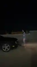 In this nighttime scene, a woman identified as Bree🩷 performs a dance move next to a black car. She lifts her leg onto the vehicle while dancing under the city lights. by @breece243 with Original Sound by Contains: ME JALO - Fuerza Regida & Grupo Frontera