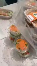 A close-up view of fresh, ready-to-eat meals from Proteinz | بروتينز, showcasing vibrant salads and healthy meal prep containers. The scene highlights convenient, nutritious options perfect for busy lifestyles. by @proteinz_sa with original sound