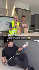 In a modern kitchen, The Magic Crasher performs a card trick. He uses a long pole to place cards into a paper bag, then snaps his fingers to make one card rise out of the top, surprising his assistant. by @themagiccrasher with Original Sound by themagiccrasher