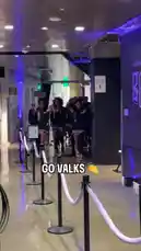 Witness the Golden State Valkyries basketball team making their energetic walkout before a game. Players in matching black hoodies and shorts clap and chant 'Go Vals!' as they march through a modern arena hallway, building excitement and showcasing team unity. by @wnba with Original Sound by wnba