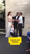 In a heartwarming moment during a wedding ceremony, a young child playfully interacts with the officiant, creating a joyful distraction for the bride and groom. This candid clip captures the unexpected charm and humor that can unfold during special events. by @eirakoze64 with Original Sound by gallad_gurey