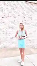 Watch Kaylee showcase her stylish light blue two-piece outfit against a white brick wall. This fashion-focused clip features a halter crop top and matching mini skirt, paired with white sneakers. The video captures her posing and adjusting her look, offering a real-time style inspiration piece perfect for summer streetwear. by @csnwkf1 with Original Sound by csnwkf1