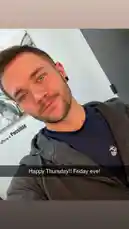 In this personal snapshot, Kenneth greets viewers with a cheerful 'Happy Thursday!! Friday eve!' text overlay. He's casually dressed in a navy t-shirt and grey hoodie, sporting a nose ring and ear gauge, with a modern indoor background featuring inspirational wall art. The moment captures the anticipation of the weekend ahead. by @ken_sutton23 with original sound