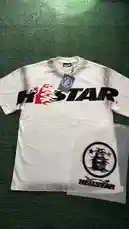 Watch as FlacoPlugz showcases a fresh Hellstar white t-shirt with bold flame graphics and logo branding. This scene-by-scene look includes the official packaging and tag details, perfect for streetwear enthusiasts and brand collectors. by @flacopyo with original sound