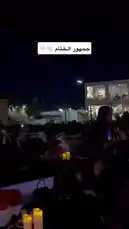 This captivating nighttime scene captures a formal gathering hosted by Jalsah event, showcasing attendees dressed in traditional attire. The elegant setting features candlelit tables, red floral arrangements, and a well-lit stage area, creating an atmosphere of sophistication and cultural celebration. by @jalsahevent with jalsahevent by Original Sound