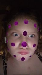 Preview for a Spotlight video that uses the purple smiley face Lens
