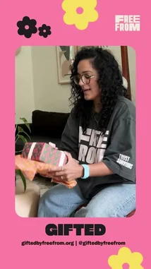 This video features actress and singer Sabrina Carpenter unboxing gifts from Free From's 'Gifted' program. She receives items made by survivors, including a jar of 'Pisces Magic' balm and a 'Trust Survivors' t-shirt, expressing her gratitude. The narrator explains that every product sold through giftedbyfreefrom.org is handmade by survivors who earn a $38-an-hour living wage, with all warehouse operations, shipping, and customer service run entirely by them. by @daisychainfield with Original Sound by daisychainfield