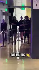 A dynamic behind-the-scenes look at the Golden State Valkyries basketball team as they walk out of their locker room and gather in a huddle. The players, dressed in matching black warm-up gear, move with focused energy through a modern corridor into a dimly lit arena space, building team spirit before the game. by @wnba with Original Sound by wnba