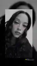 A close-up shot of a woman with long dark hair and striking makeup. She has glitter on her face, visible under black and white filter. She moves her head slightly and looks at the camera while music plays. by @stephaniruizzz with prove it by 21 Savage & Summer Walker