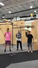 Three men, including Winchumbo, prepare for a parkour challenge in an indoor gym. They pick up poles and launch themselves into the air, performing impressive mid-air tricks. The text overlay 'did NOT expect that 😳' hints at a surprising outcome, capturing a moment of athletic skill and suspense. by @winchumbo with Original Sound by Contains: Fight Song - Rachel Platten