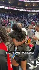 A WNBA player celebrates her team's victory by sharing heartfelt hugs and high-fives with fans in the stands after the game. She interacts warmly with supporters of all ages, creating a joyful and connected atmosphere in the arena. by @wnba with Original Sound by wnba