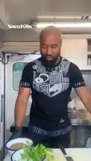 In a unique celebration of French-Senegalese culture ahead of the national football match, Chef Rudi from the 'New Soul Food' food truck creates a fusion dish. He prepares a Senegalese-inspired marinade with thyme, millet, basil, parsley, and tomatoes, then grills chicken over wood charcoal—a technique he notes is essential, just like in Senegal. This culinary collaboration brings the best of both cultures together. by @lenouvelobs with Original Sound by lenouvelobs