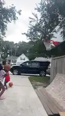 Two young children are playing basketball in a residential driveway. One child dribbles the ball towards the hoop while the other runs alongside. They take turns shooting at the hoop, capturing a fun and active moment of outdoor play. by @marcus.randall with Original Sound by marcus.randall