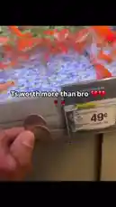 A hand holds two coins next to a price tag showing 'COMET GOLDFISH (LG)' for just 49 cents. The text overlay reads 'Ts worth more than bro 💔💔'. In the background, a large aquarium teems with dozens of bright orange comet goldfish swimming among blue gravel and green plants. by @rizznmemes with Original Sound by rizznmemes