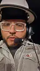 A behind-the-scenes look at a drilling operation at night, featuring Tomas Guerrero. The video starts with a close-up of Tomas wearing safety gear, then pans across a muddy site illuminated by bright lights, showing large hoses and equipment. by @tomasg3901 with Original Sound by tomasg3901