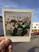 This short-form visual captures a candid moment held by Jez Dior, showing a Polaroid-style photo of two individuals posing outdoors in a casual urban setting. The scene suggests a behind-the-scenes vibe, possibly related to lifestyle, fashion, or music culture. With its nostalgic aesthetic and real-life authenticity, the clip evokes curiosity about the story behind the image, inviting viewers to explore more of Jez Dior's creative world. by @jezdior with original sound