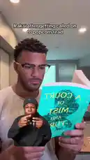 In this humorous and relatable moment, a man reads 'A Court of Mist and Fury' while reacting with exaggerated expressions to a 'popcorn read' text overlay. The scene captures the comedic tension of being unexpectedly called out, perfectly embodying the viral 'Rakai after getting called on to popcorn read' meme format. by @findjeremiah with Original Sound by findjeremiah