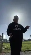 A person, identified as Wyatt Soderstrom, stands outdoors in a field under a bright sun, performing a song. He wears a black hoodie with white graphics and a backwards baseball cap. As he sings, lyrics such as 'you were so good to me' and 'was love just never same' appear on screen, matching his vocal performance. His expressive hand gestures and direct gaze suggest a heartfelt delivery. by @wyattsoderstrom with Original Sound by wyattsoderstrom