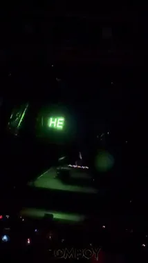 Witness Sasha's electrifying performance as the stage transforms. It begins with a simple 'HE IS' message, then erupts into a dazzling spectacle of green and purple lights, creating a massive geometric pattern. The crowd is fully engaged, their hands raised in unison, as the dynamic visuals pulse with the music. by @squashha with squashha by Original Sound