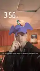 In this candid behind-the-scenes look, music artist Jez Dior shares his creative process after wrapping a photoshoot. Wearing a playful purple elephant hat with colorful pom-poms, he reflects on the experience in a casual indoor setting. The footage captures a moment of post-production thoughtfulness, offering fans an intimate glimpse into his artistic journey. by @jezdior with original sound